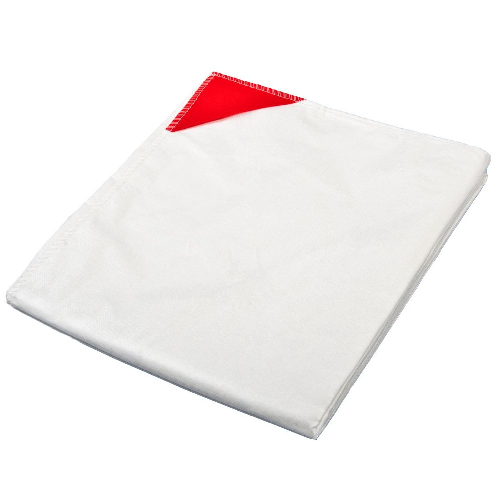 Weiße NOBAKARP Einmal-Patientendecke aus Vliesstoff mit roten Befestigungsecken für den Krankentransport.